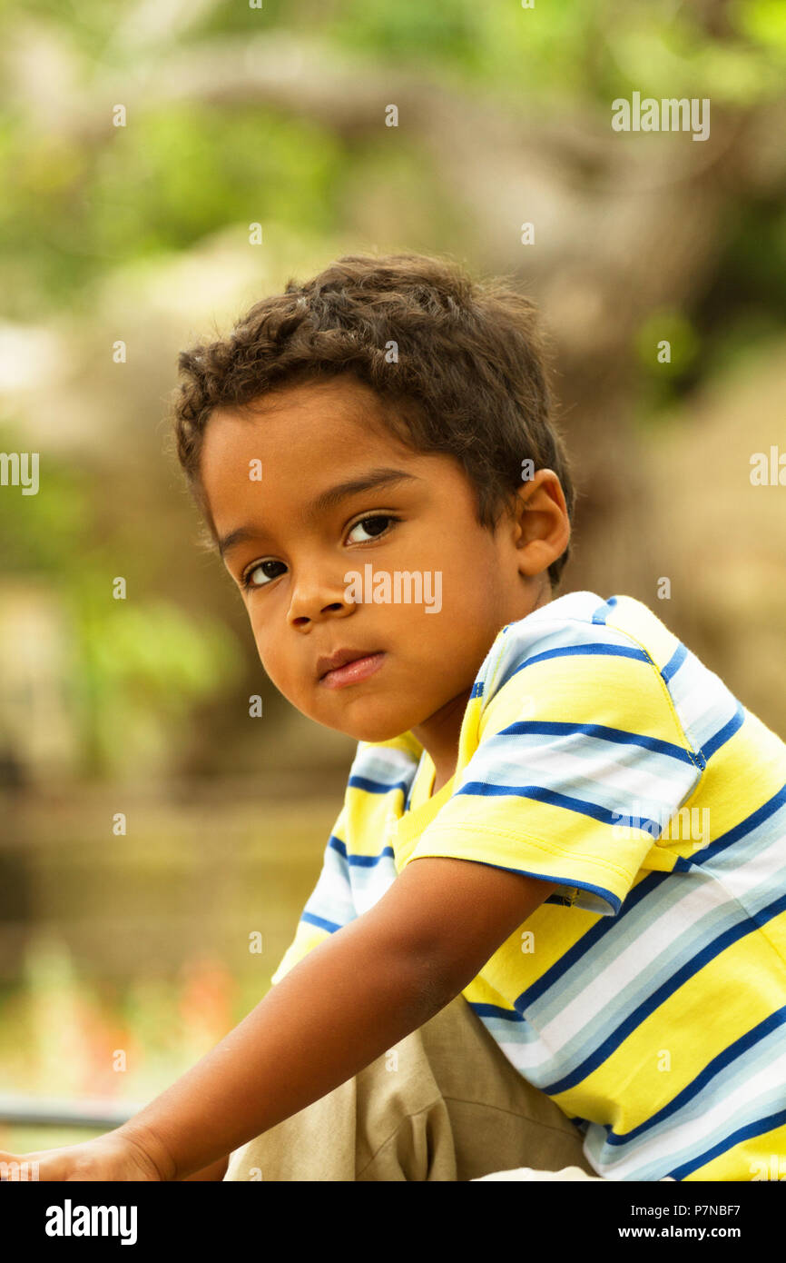 Cute little hispanic boy smiling and outside playing Stock Photo - Alamy