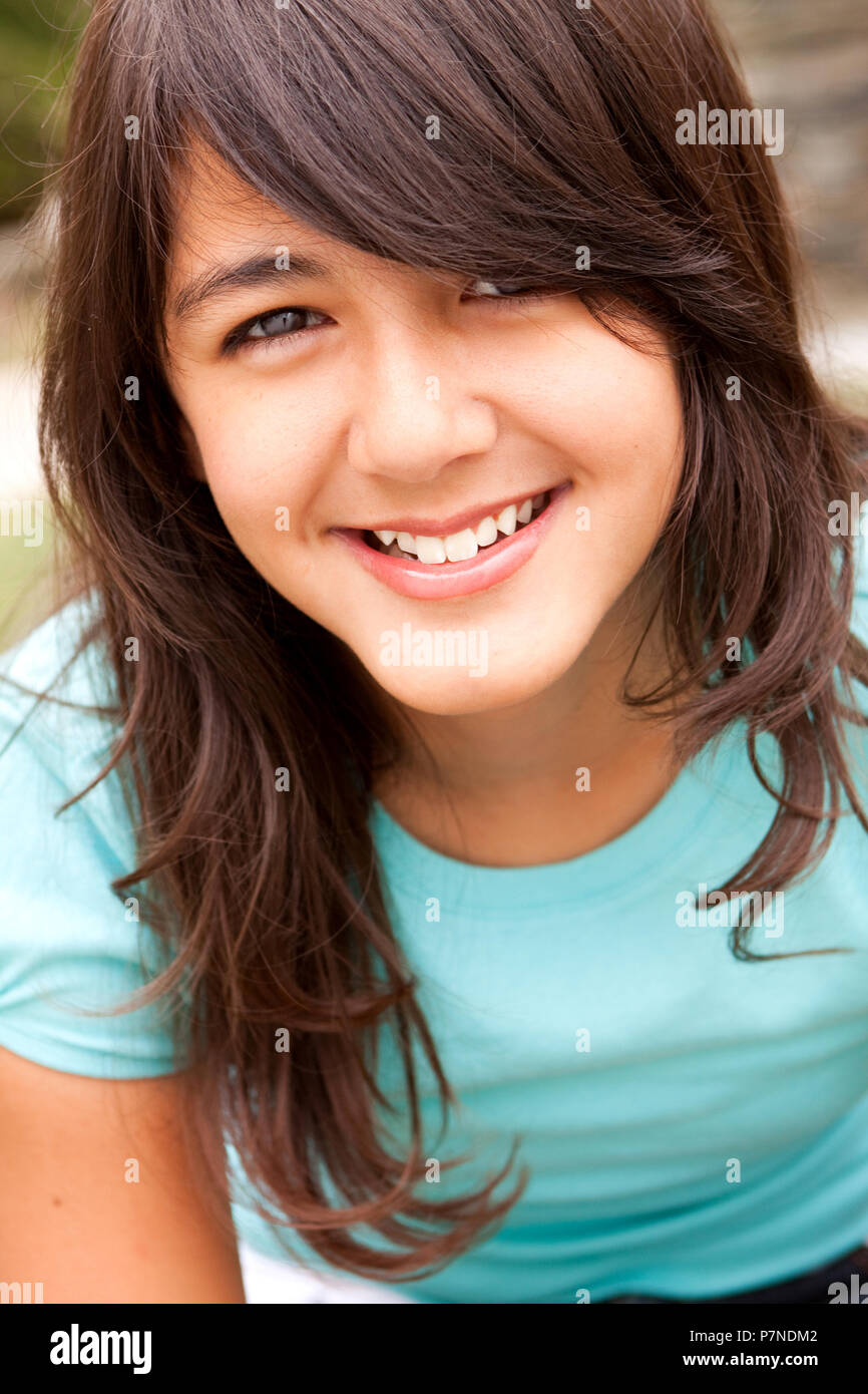 Portrait of a cute little girl smiling outside Stock Photo - Alamy