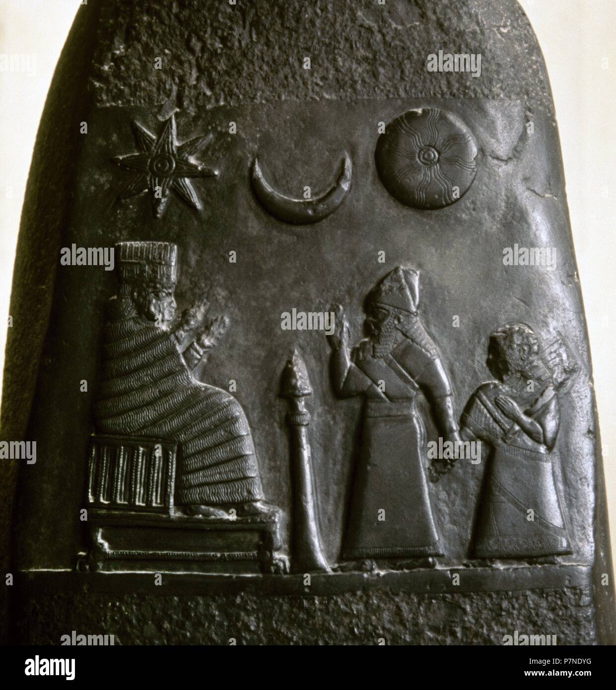 Kudurru (stele) of King Melishipak I (1186Ð1172 BC). The king introduces his daughter to the goddess Nannaya. The crescent moon represents the god Sin, the sun the Shamash and the star represents the goddess Ishtar. Kassite period, taken to Susa in the 12th century BC as war booty. Louvre Museum. Paris, France. Stock Photo