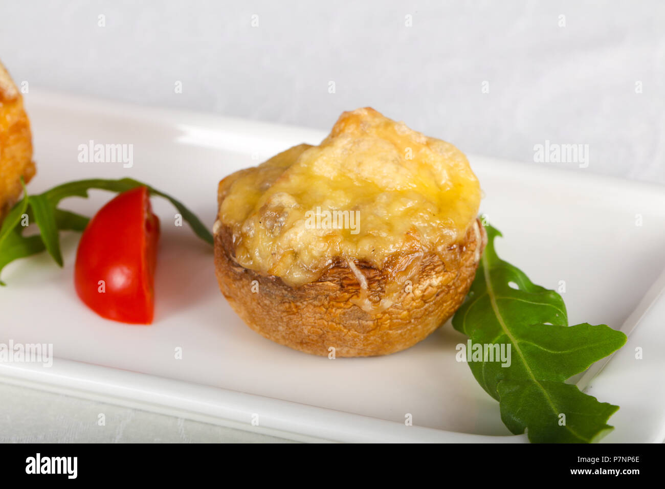 Baked mushrooms champignon with cheese Stock Photo - Alamy