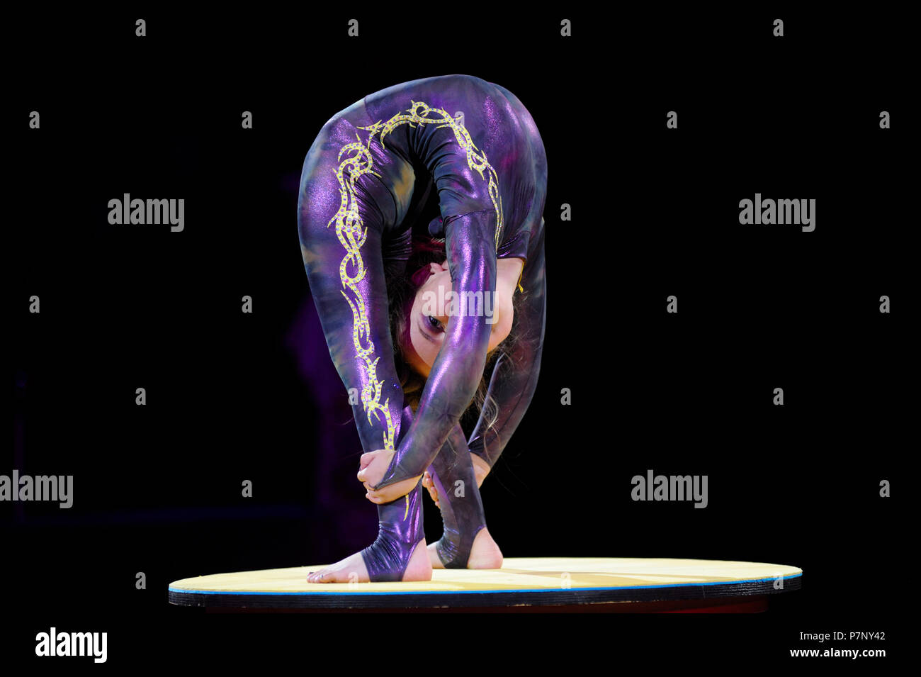 Acrobat (caoutchouc) baby girl performing on the ring of the circus. June 10, 2018. Kiev, Ukraine Stock Photo