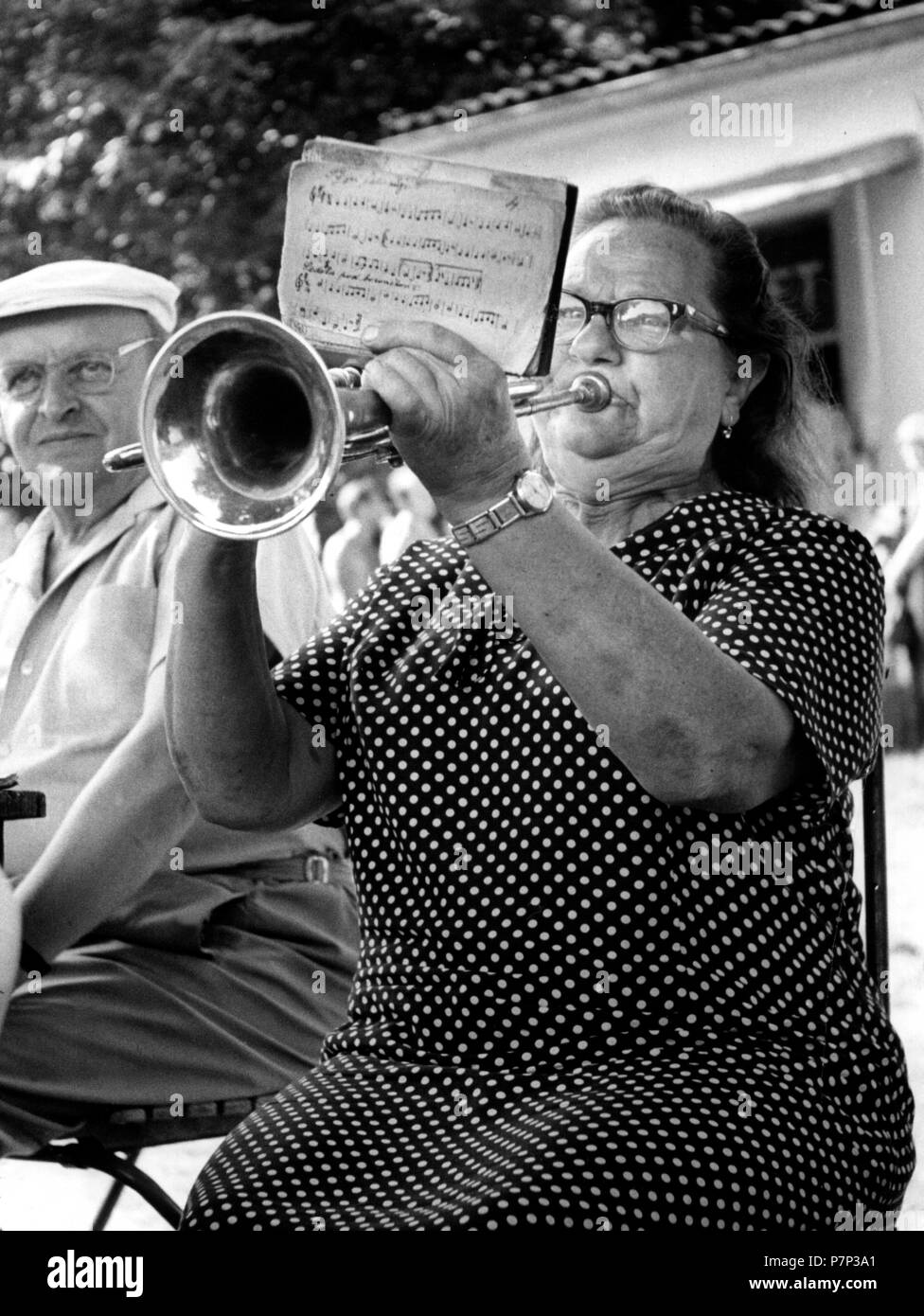 Grandma plays trumpet ca. 1970s, exact place unknown, Czech Republic Stock Photo