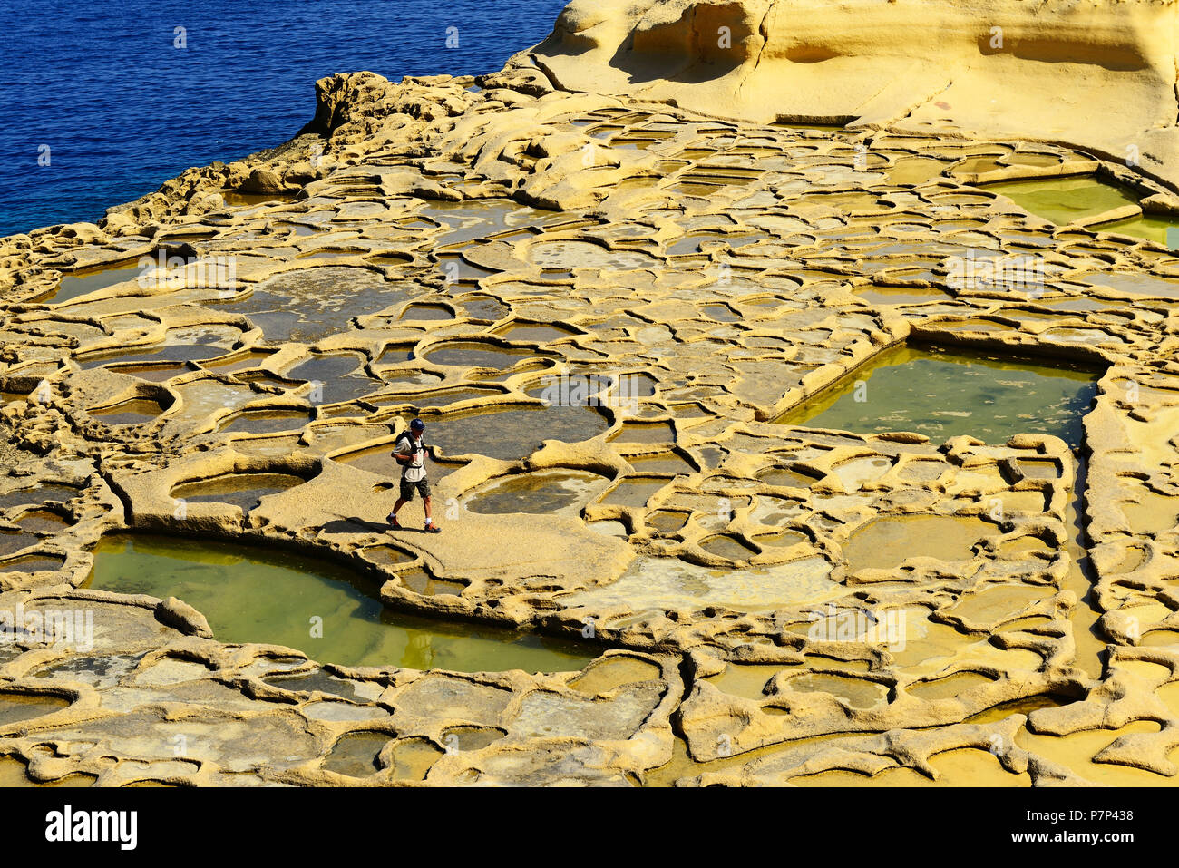 Hiker at Gozo Salt Pans, Xwejni Bay, Gozo Island, Malta Stock Photo Alamy