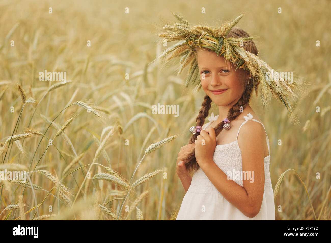 young girl in the yellow field Stock Photo - Alamy