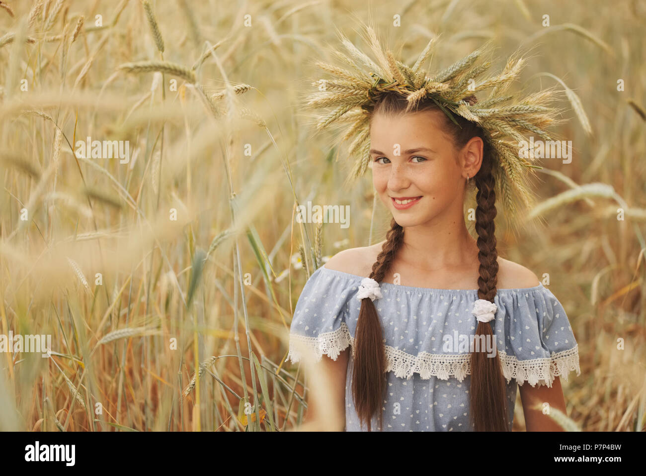 young girl in the yellow field Stock Photo - Alamy