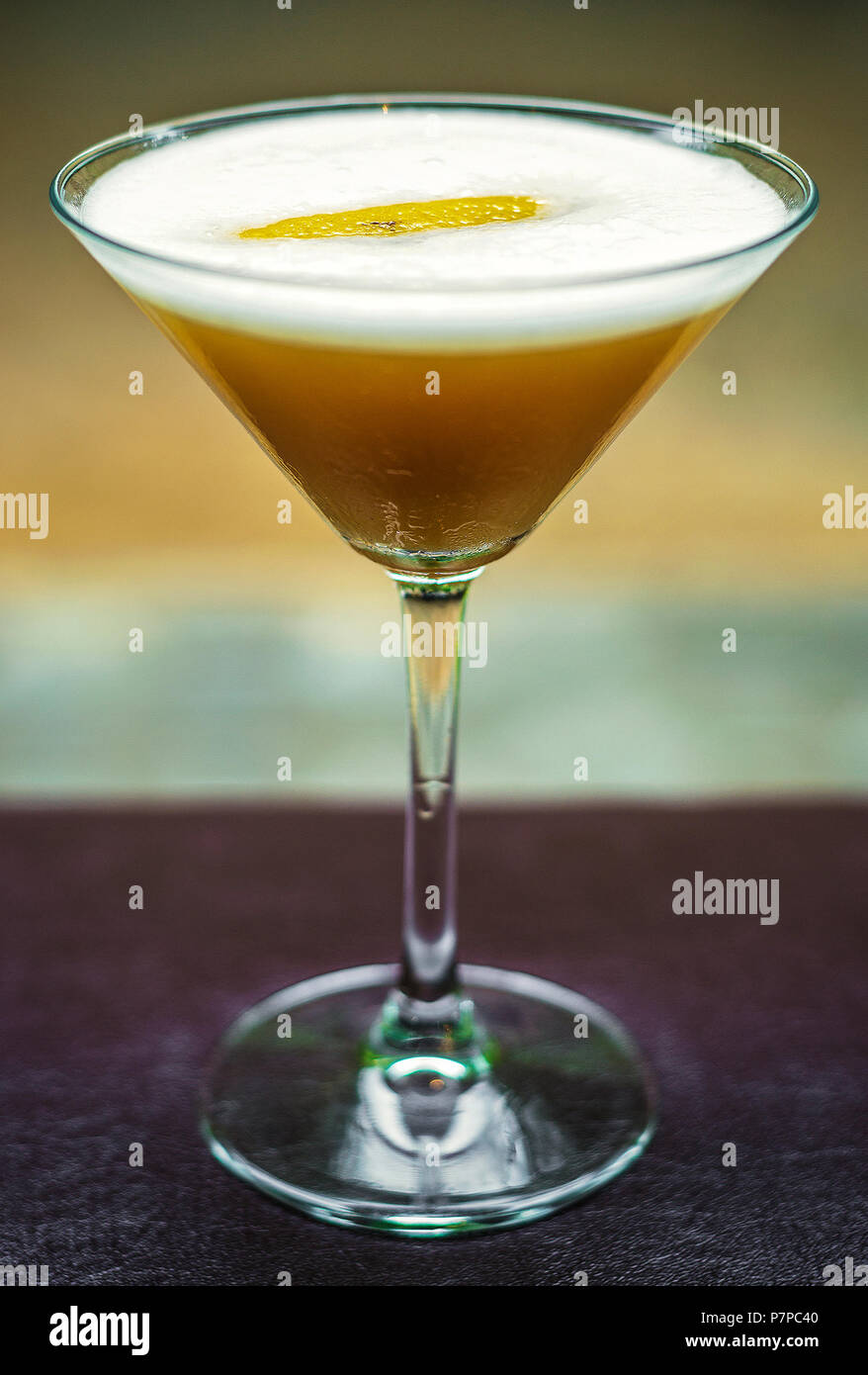 lemon and honey martini cocktail drink glass on bar Stock Photo