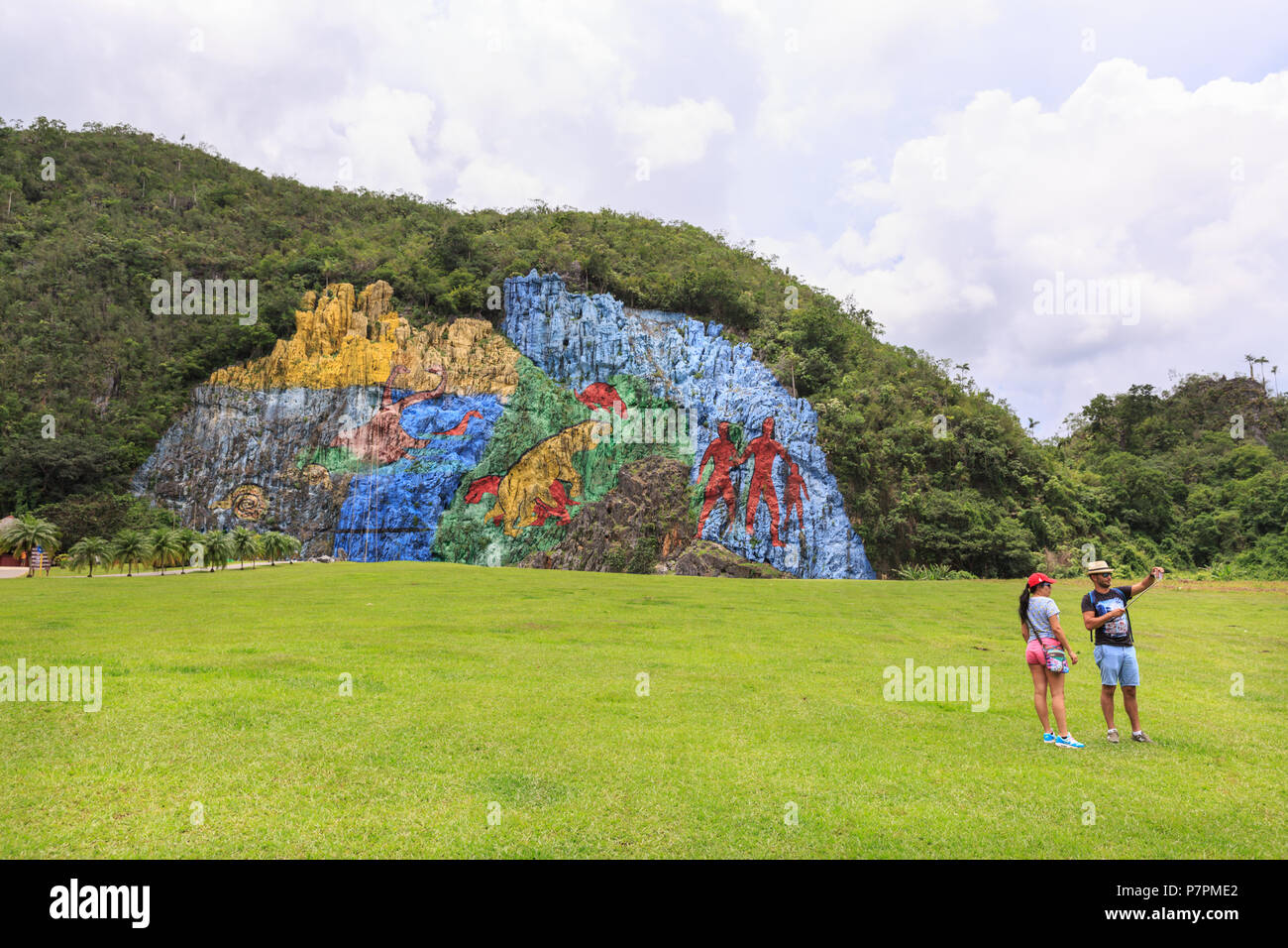 Tourist attraction, giant stone wall painting made to look like a prehistoric work, in Parque Nacional Viñales, Sierra de Viñales, Cuba Stock Photo