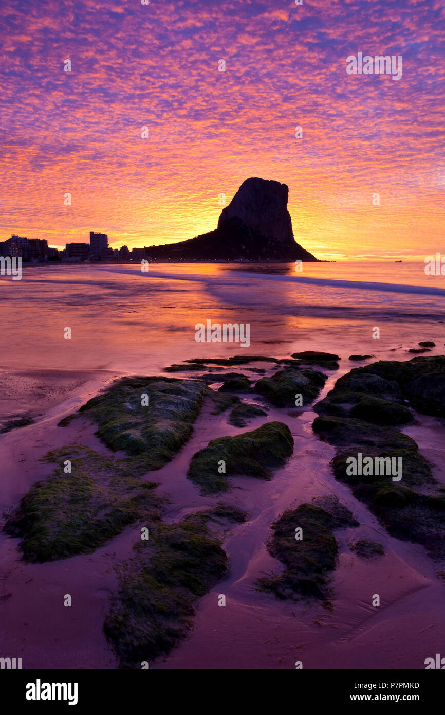 Colourful sunrise behind the Penon de Fach nature reserve Stock Photo