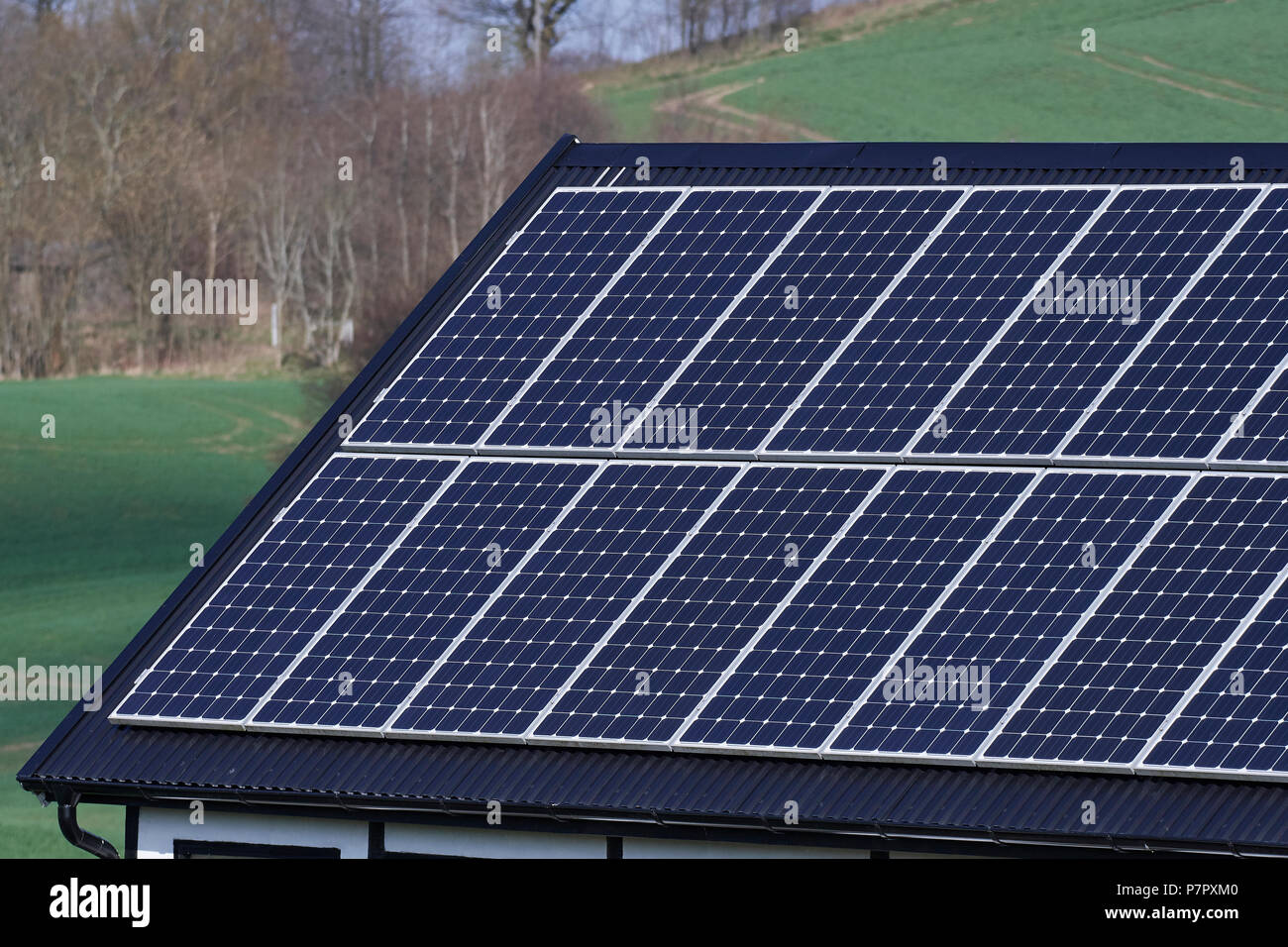 Flat plate solar thermal collectors on a black roof Stock Photo - Alamy