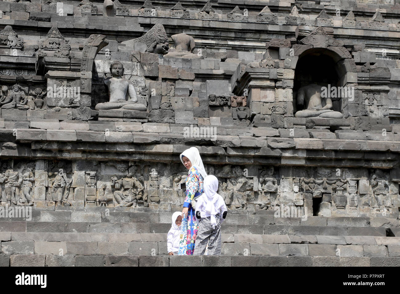 Borobudur, Indonesia - June 23, 2018: Tourists at the Buddhist temple of Borobudur, near Jogjakarta Stock Photo
