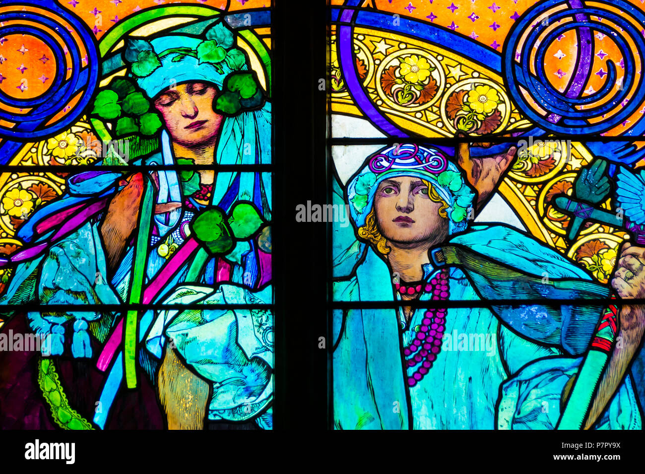 Detail of art nouveau stained glass window by Alfons Mucha, St. Vitus Cathedral, Prague castle, Czech Republic - women who symbolize Czech and Slovaki Stock Photo