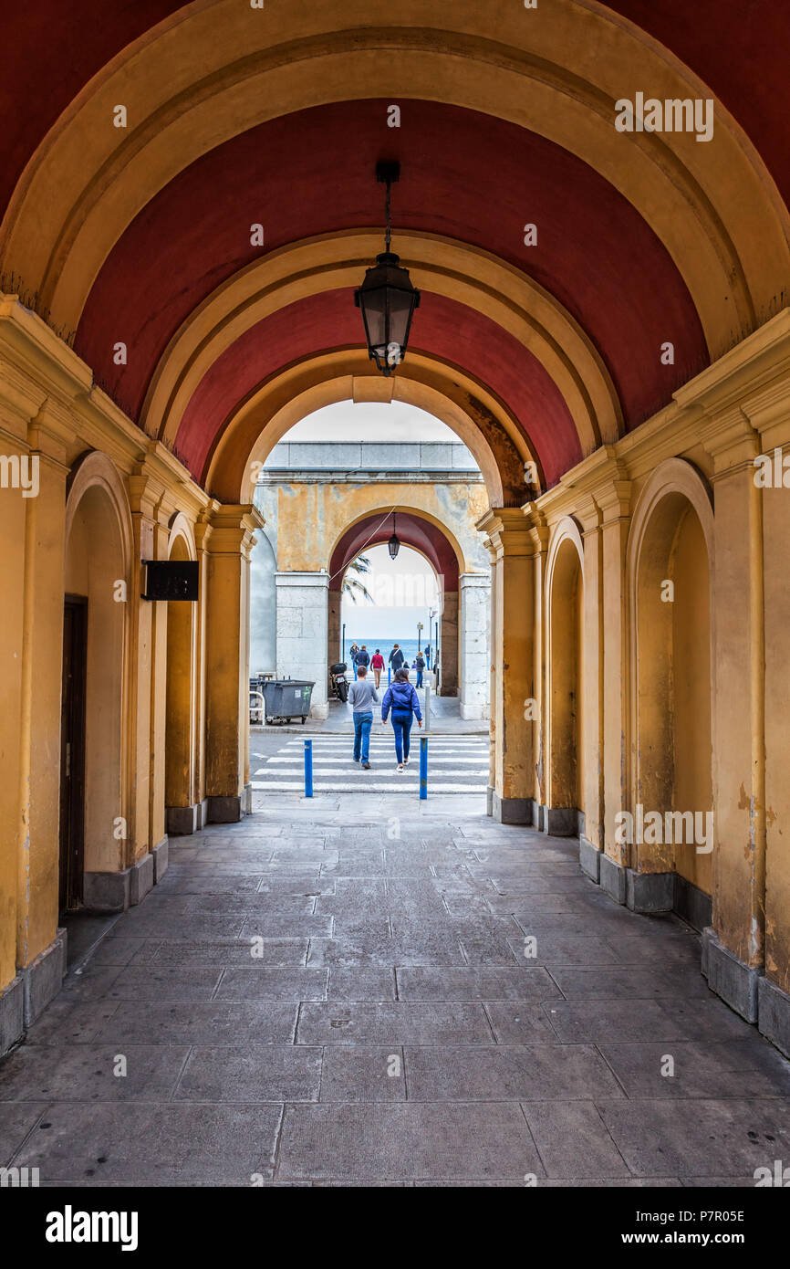 Arched passage from Cours Saleya market to the sea in city of Nice, France Stock Photo