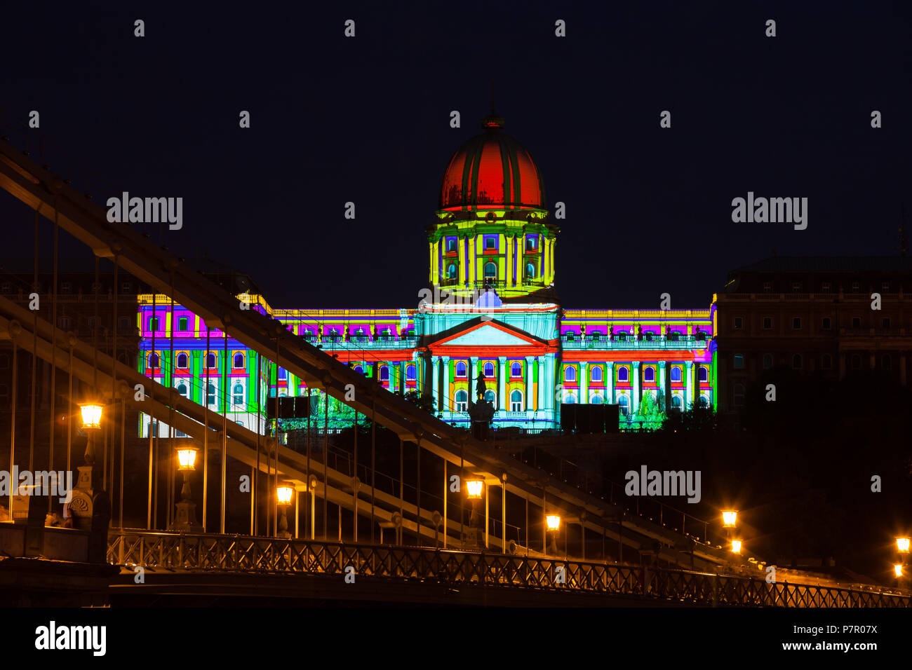 City of Budapest in Hungary, Szechenyi Chain Bridge and Buda Castle illuminated at night Stock Photo