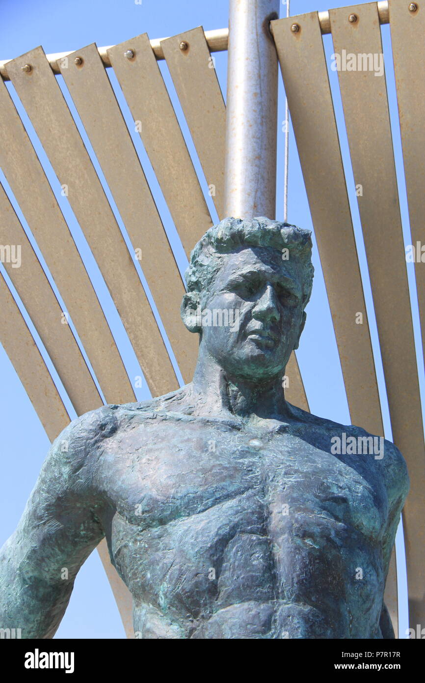 Bronze statue in memory of the Unknown Sailor situated in the old port of Skiathos Town, Skiathos Island, GREECE, PETER GRANT Stock Photo