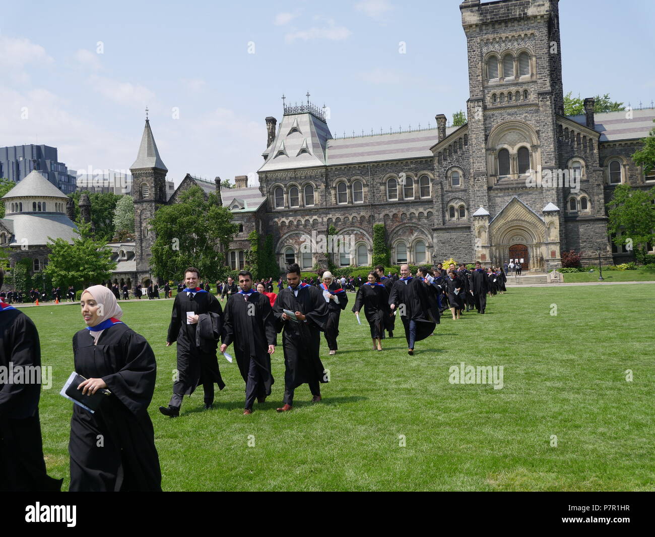Graduates of the Faculty of Medicine at the University of Toronto march