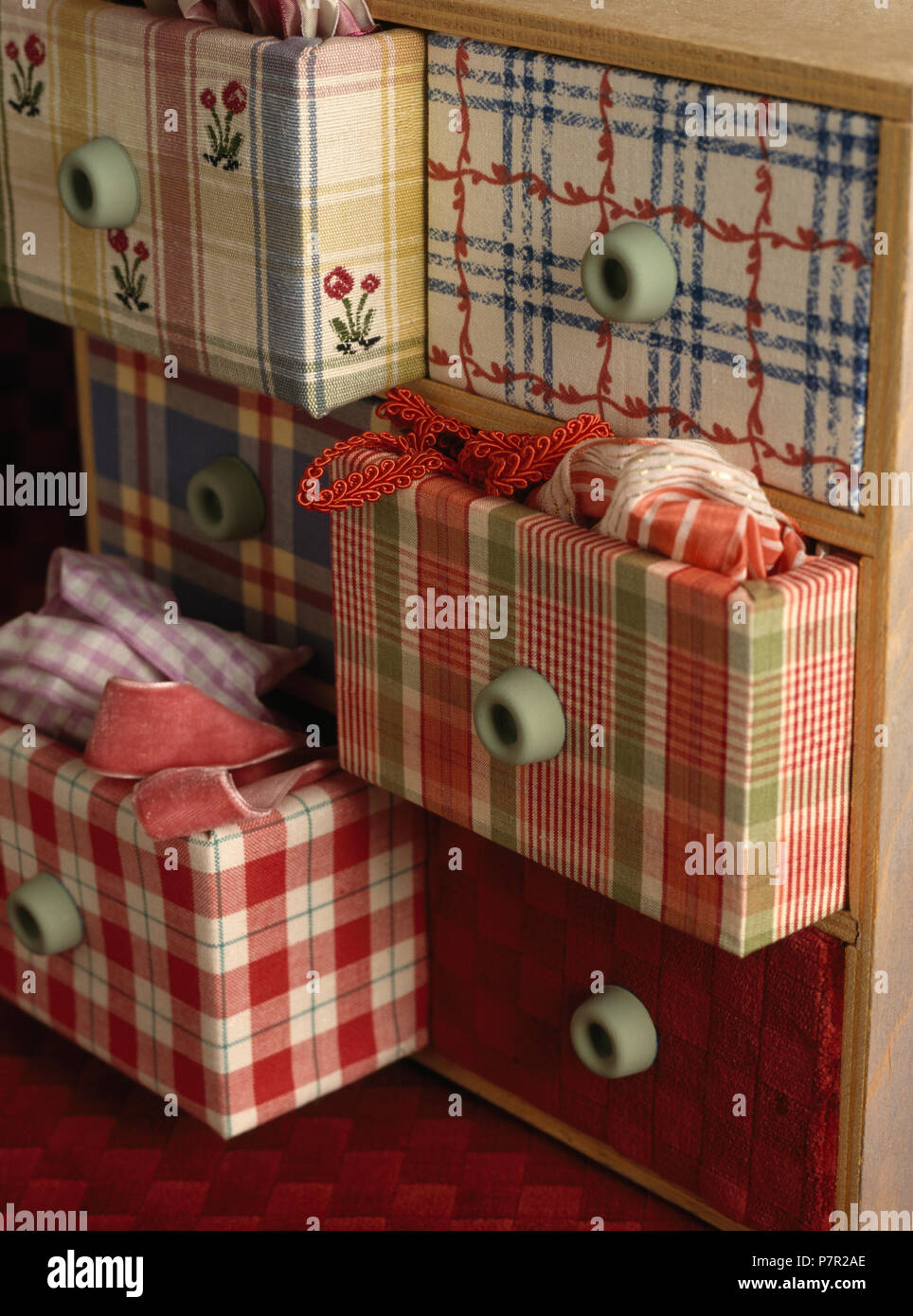 Fabric Covered Drawers With Rubber Knobs On Newly Renovated