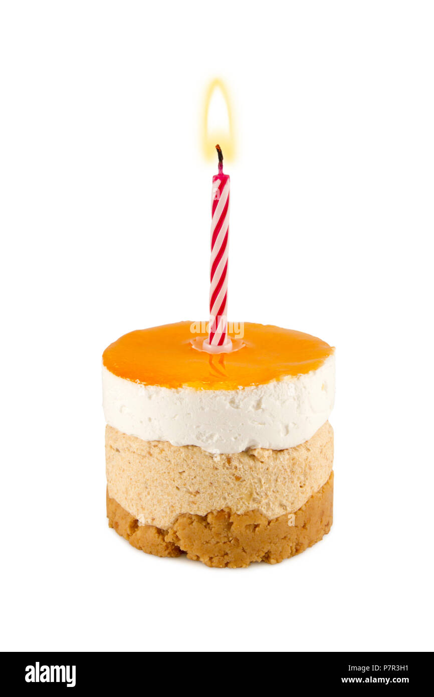 Small orange birthday cake with candle Stock Photo Alamy