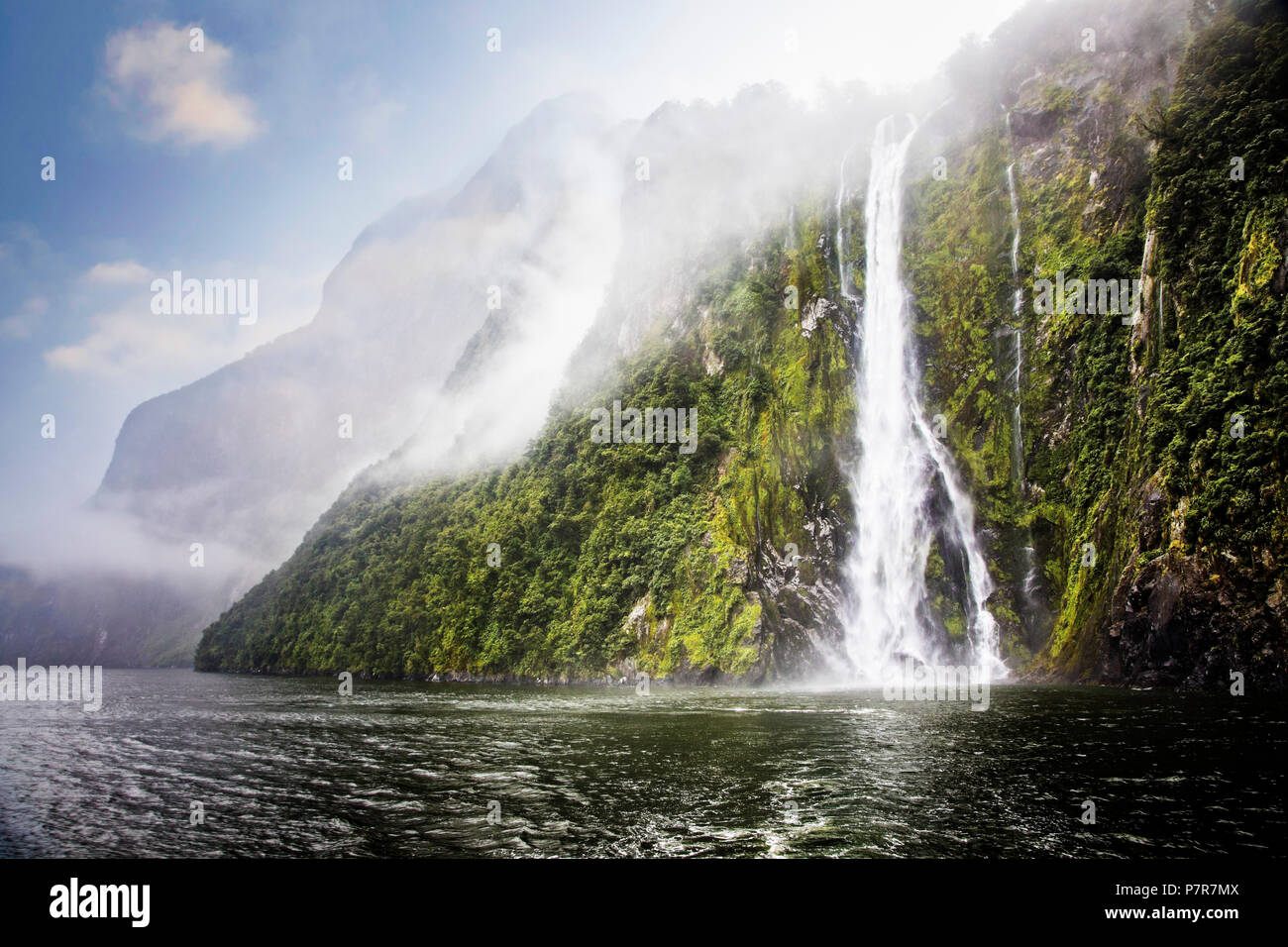 Water from rainfall cascades down mountainsides. Milford Sound in Fiordland, South Island, New Zealand. Stock Photo