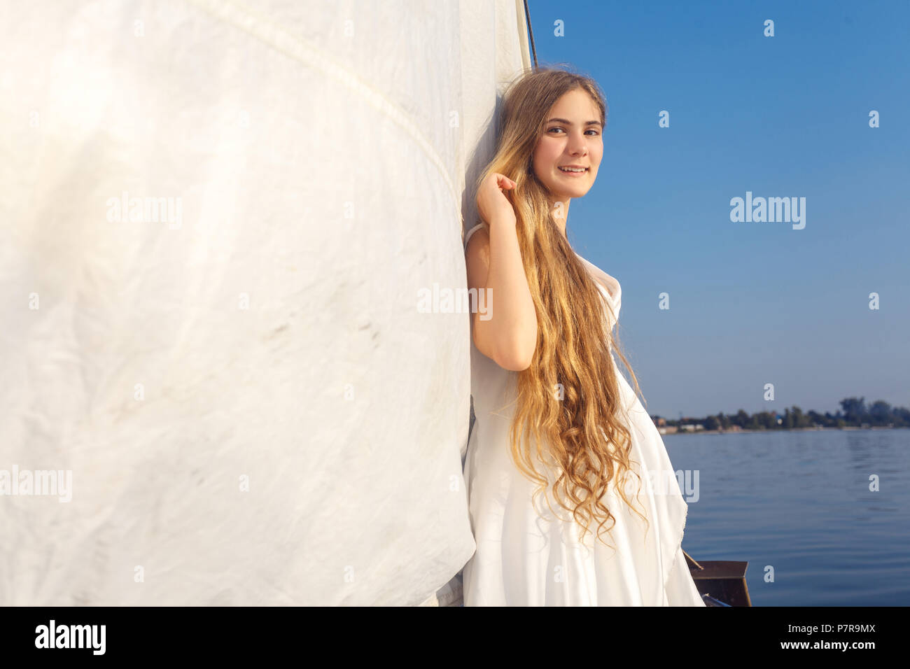 Portrait Of Happy Toothy Smiley Pretty Girl With White Dress And