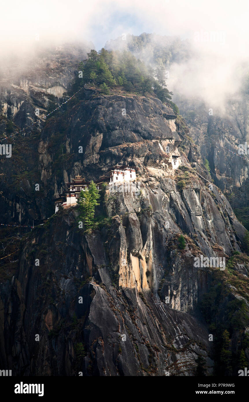 Paro Taktsang is the popular name of Taktsang Palphug Monastery or Tigers Nest outside of Paro, Bhutan in the foothills of the Himalaya. Stock Photo
