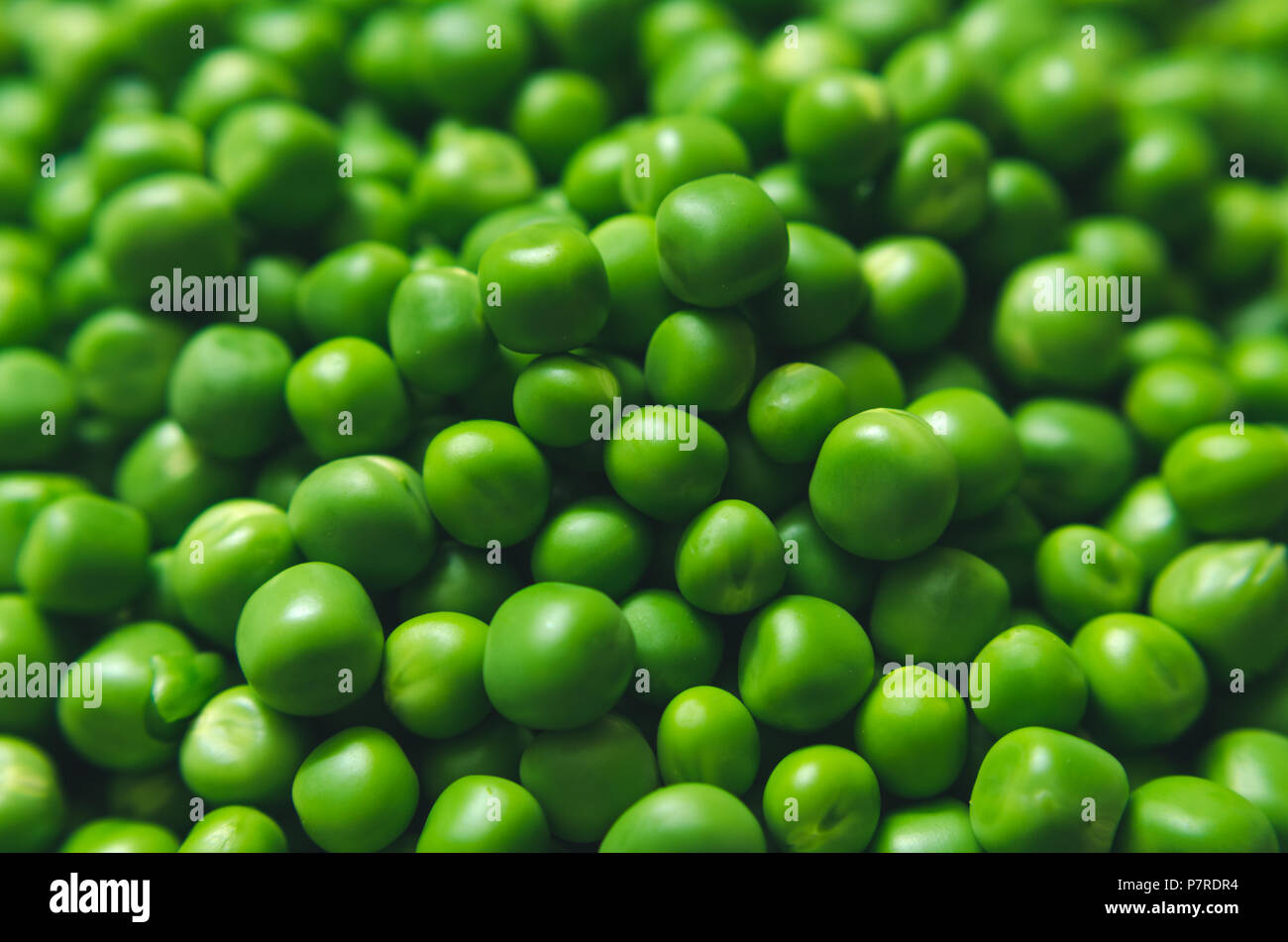 A whole lot of shelled Green peas Stock Photo