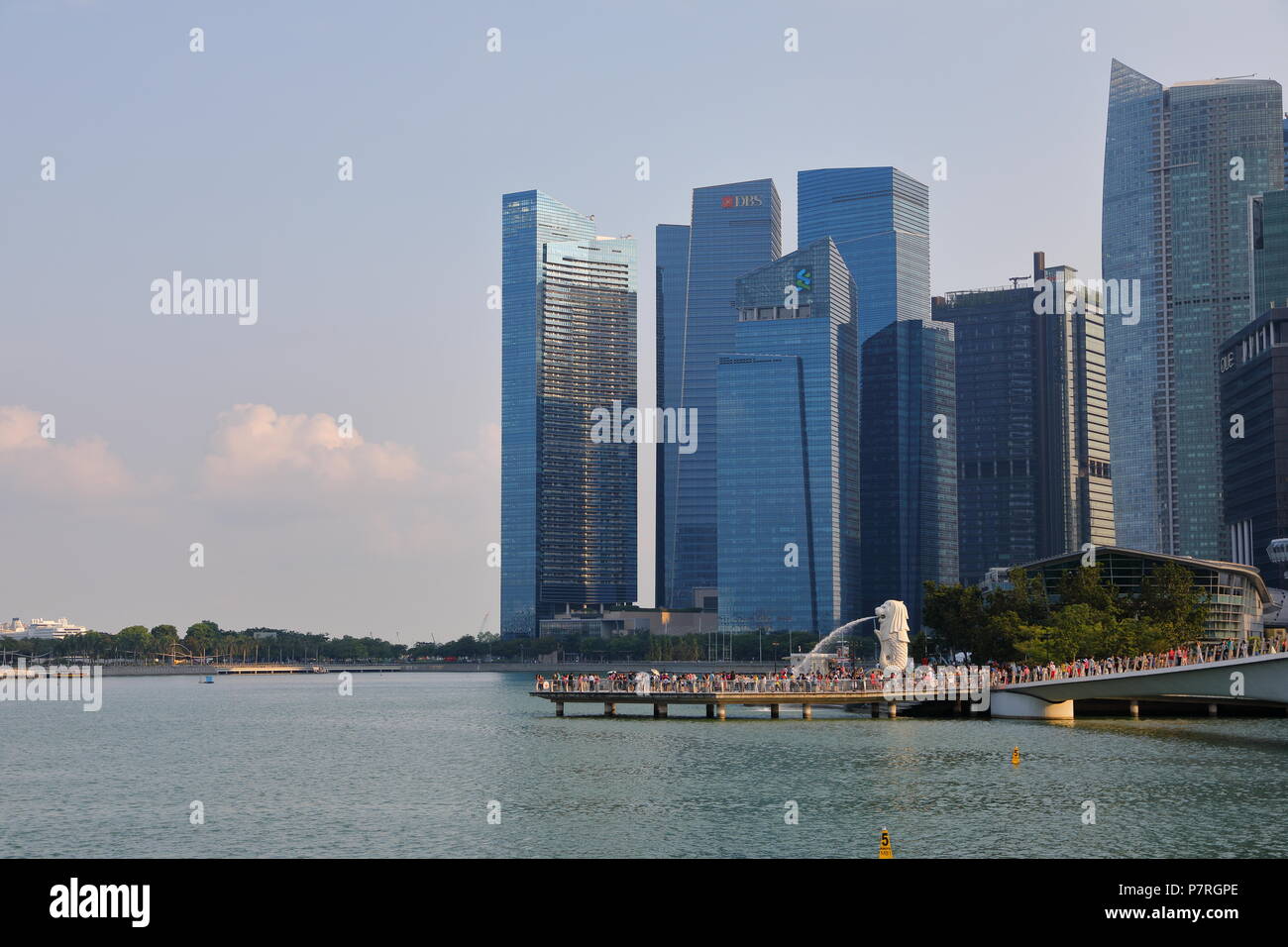 Singapore - April 2018: The skyline view was taken at waterfront promenade, Marina Bay. The other side of the harbor is the Merlion full with tourist Stock Photo