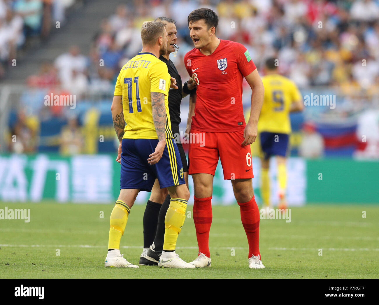 Sweden S John Guidetti Left And England S Harry Maguire Exchange Words During The Fifa World Cup Quarter Final Match At The Samara Stadium Stock Photo Alamy