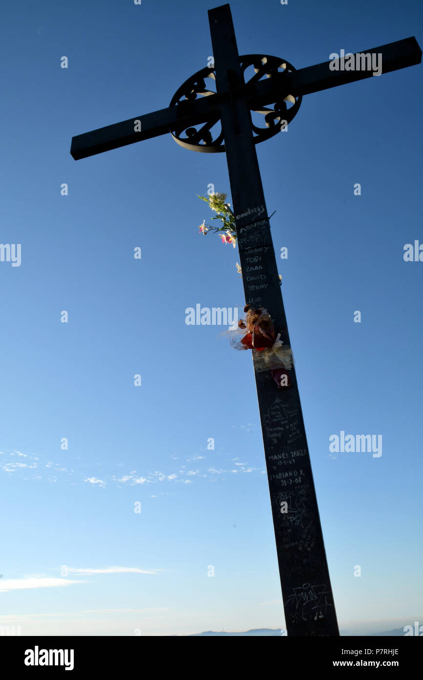 Cross Saint Miguel, Montserrat Monastery, Catalonia, near Barcelona, Spain. Close Up Detail with Sunrise Blue Sky Stock Photo