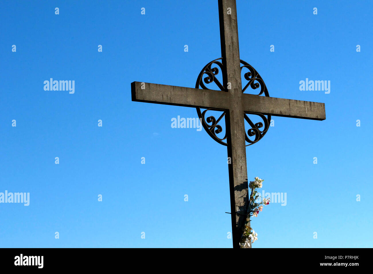 Cross Saint Miguel, Montserrat Monastery, Catalonia, near Barcelona, Spain. Close Up Detail with Sunrise Blue Sky Stock Photo