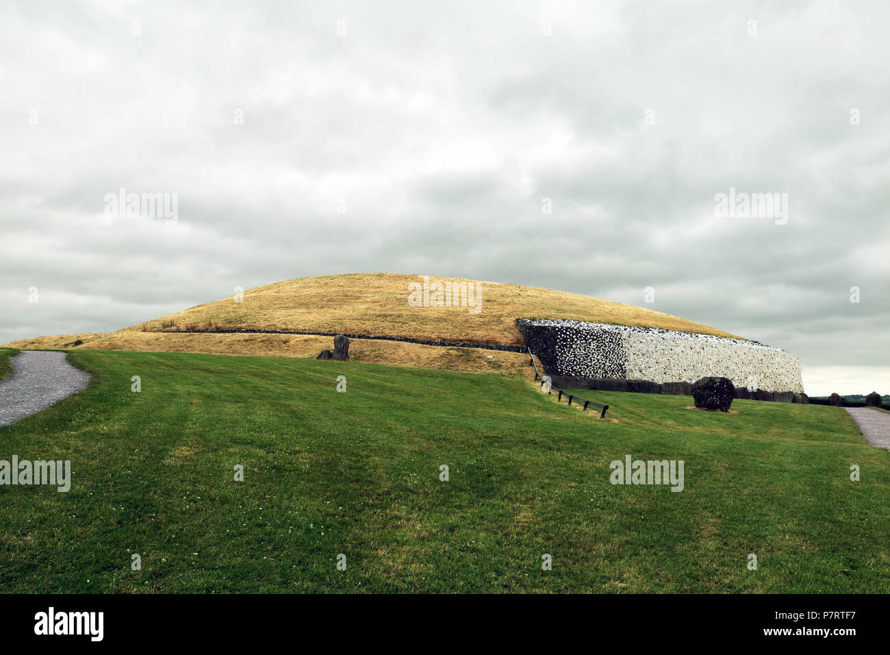 Newgrange  is a prehistoric monument in County Meath, Ireland,  It was built during the Neolithic period, around 3200 BC, making it older than Stonehe Stock Photo