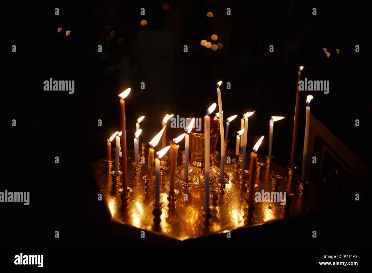 lighting fire candles in russian orthodox church Stock Photo Alamy