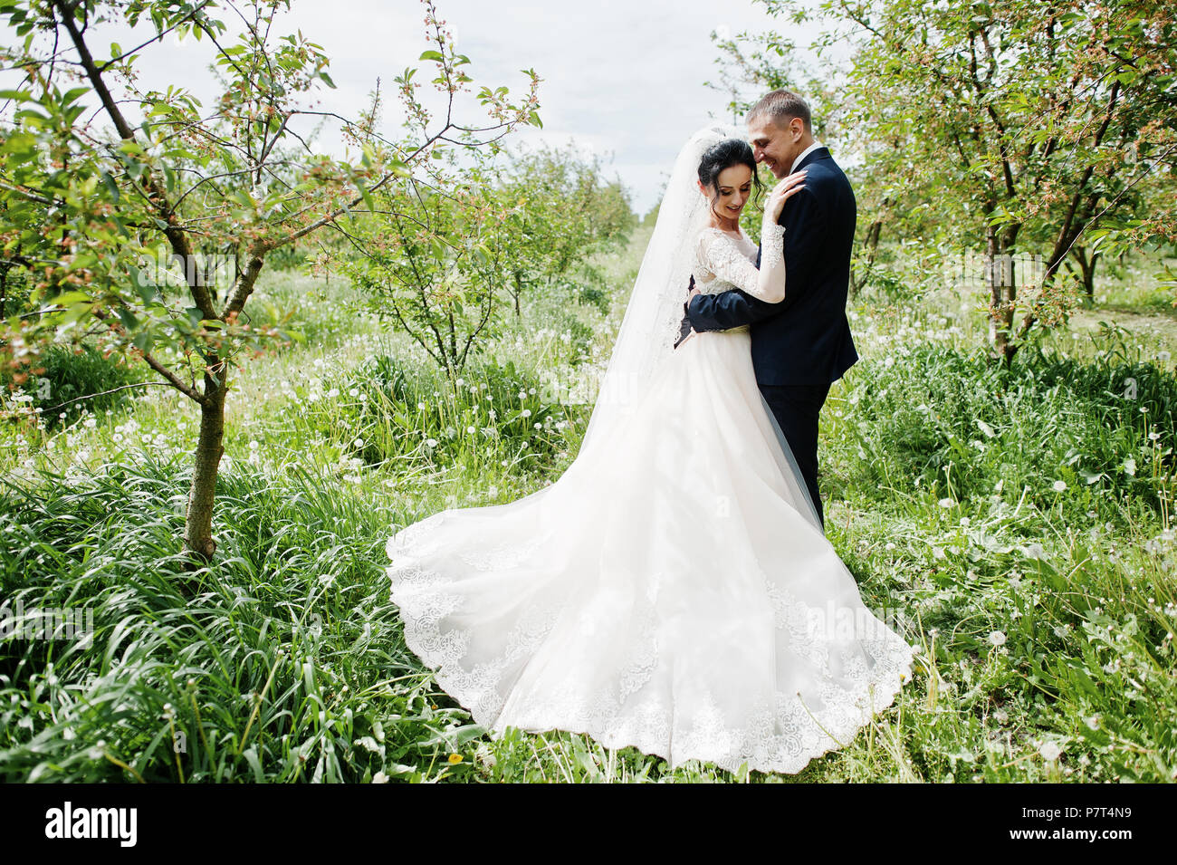 fabulous-wedding-couple-having-their-time-outdoors-in-the-garden-on-a