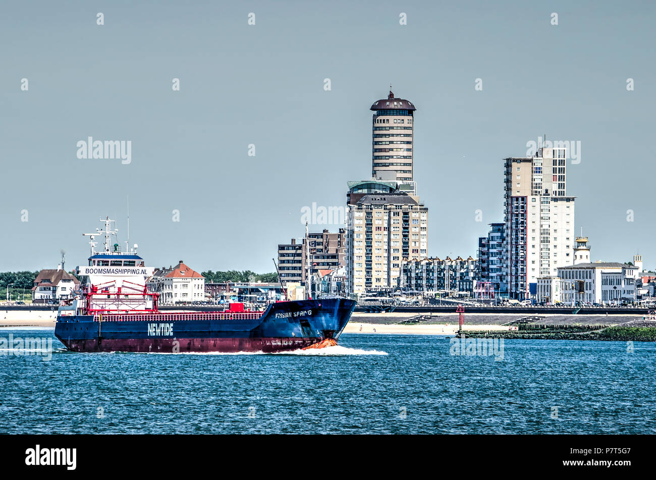 Vlissingen (Flushing), The Netherlands, July 2nd, 2018: Vessel on western Scheldt estuary passing close to the city's waterfront Stock Photo