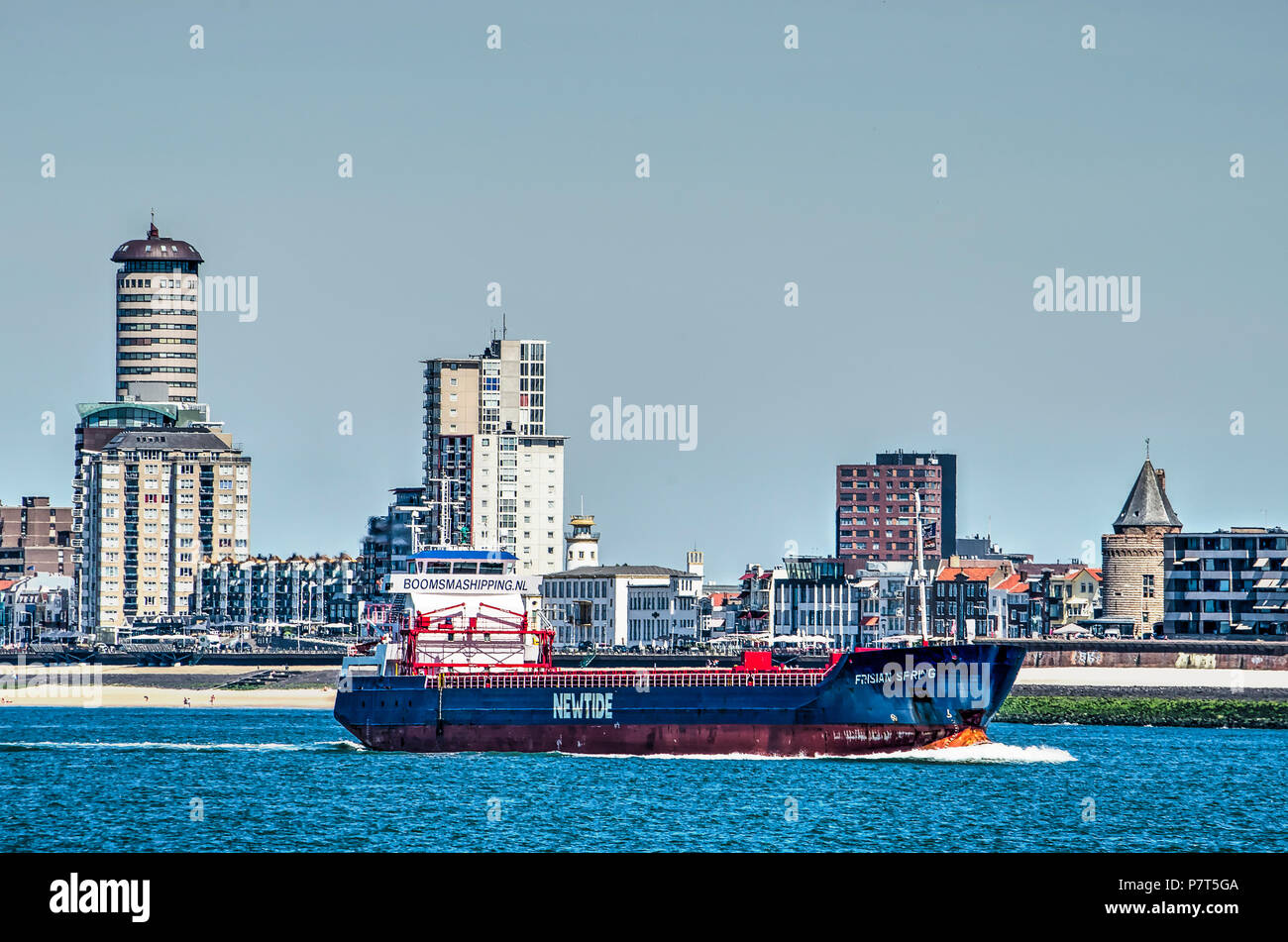 Vlissingen (Flushing), The Netherlands, July 2nd, 2018: Vessel on Western Scheldt estuaryon its way to Antwerp passing close to the seaside promenade Stock Photo