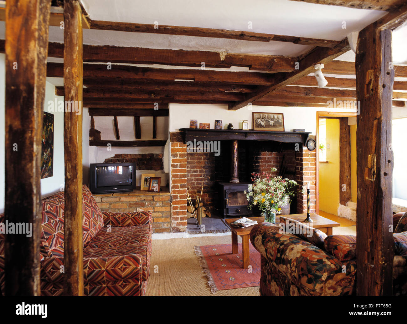 Patterned Sofas And Rustic Wooden Beams In Eighties Style Country