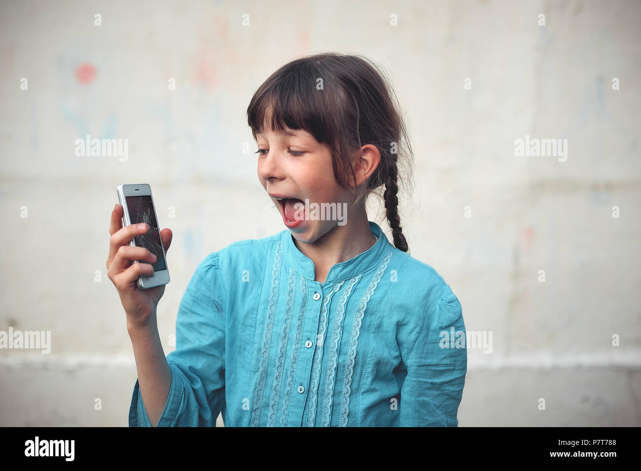 Broken glass screen smartphone in hand of upset girl, white background ...