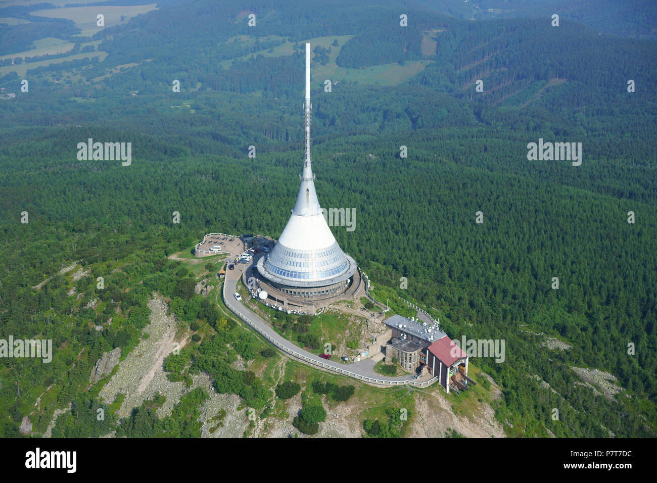 AERIAL VIEW. Hyperboloid structure (height: 94m) on Mount Ještěd (elevation: 1012m) used as a TV antenna and a hotel. Ještěd Tower, Liberec, Czechia. Stock Photo