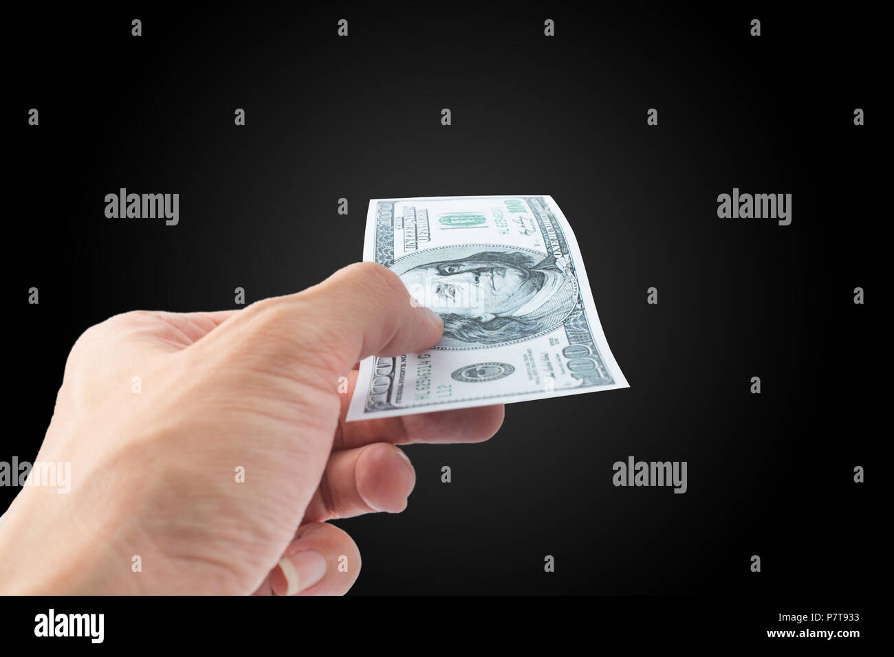 Pay money Dollar bank note on black background Stock Photo