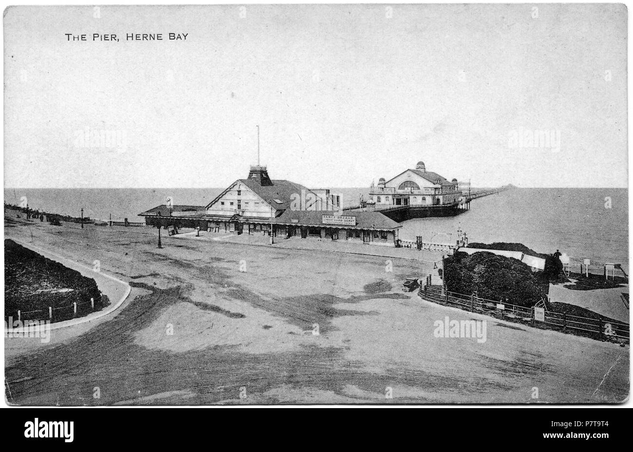 Postcard dated 1910-1928 showing the third Herne Bay Pier which was built 1899. The Grand Pier Pavilion was built 1910, and the theatre and shops at the pier entrance burned down 1928. between 1910 and 1928 10 3rd Herne Bay Pier 1910-28 031 Stock Photo