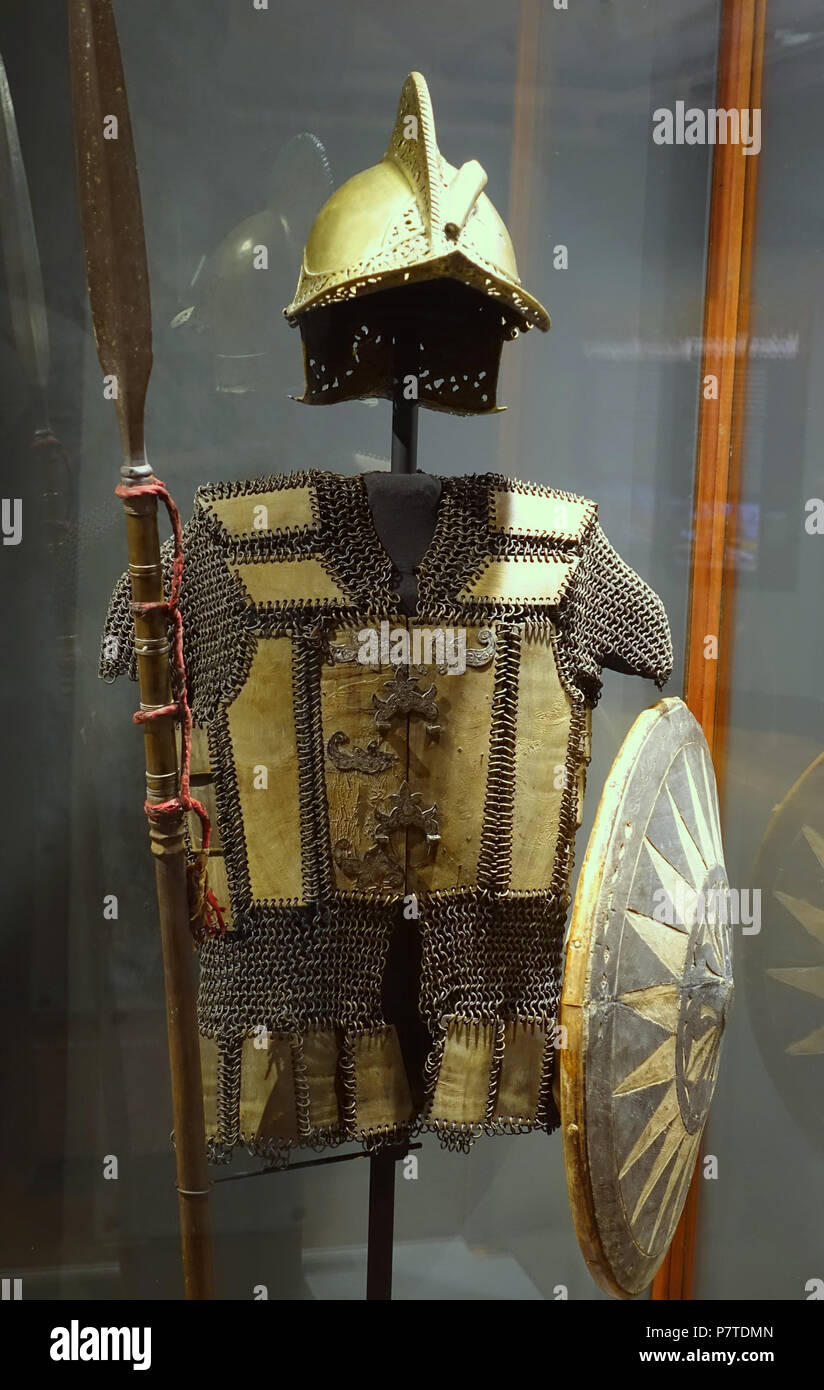 English: Exhibit from the Pacific Collection, Peabody Museum, Harvard University, Cambridge, Massachusetts, USA. Photography was permitted without restriction; exhibit is old enough so that it is in the . 27 May 2017, 15:24:15 26 Armor, helmet, shield, and spear (budiak), Moro, Philippines, water buffalo horn, wood, brass, silver - Pacific collection - Peabody Museum, Harvard University - DSC06027 Stock Photo