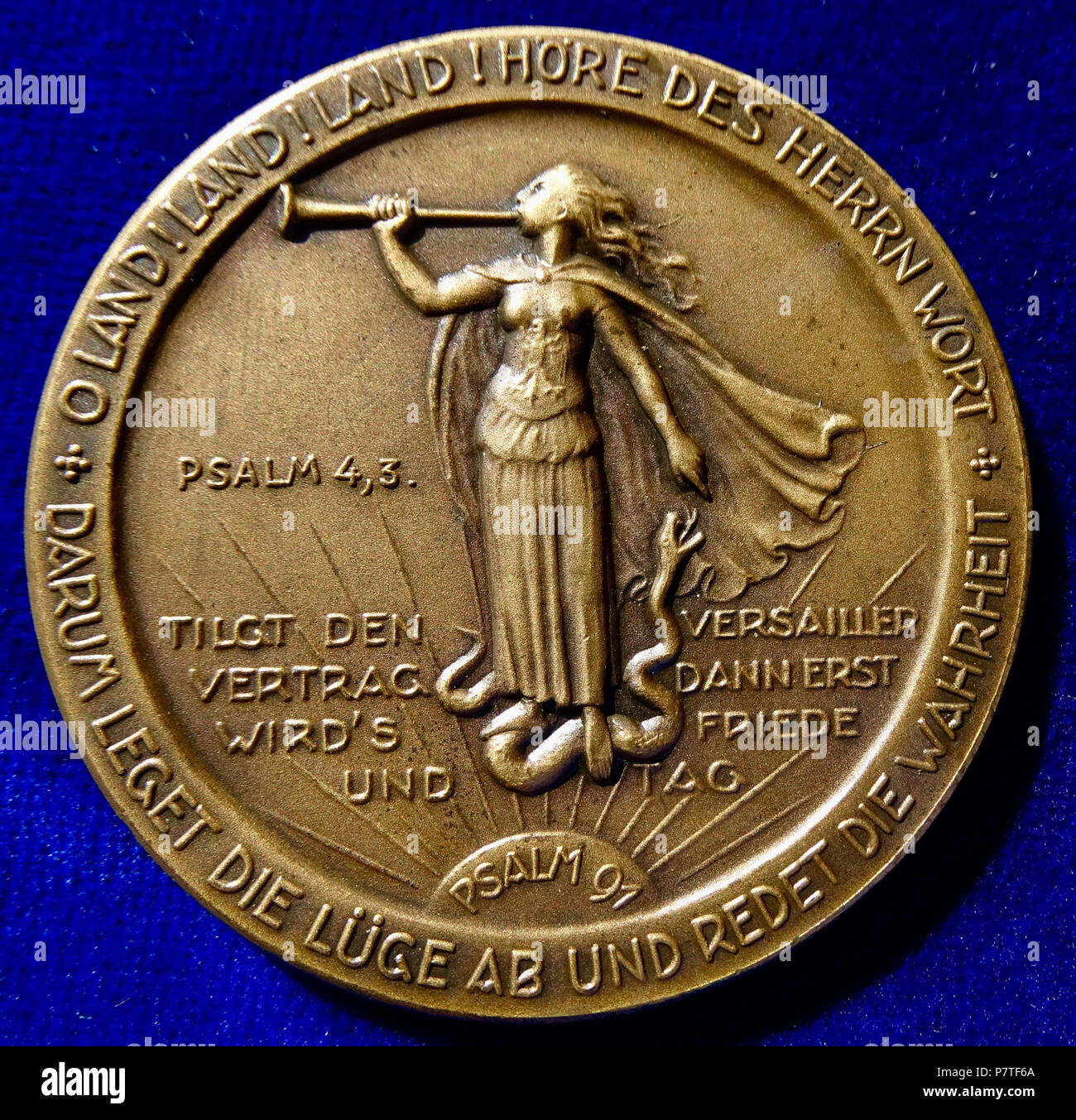 English: German Medal 1925, Opening of the Stockholm Universal Christian Conference in Sweden. Bronze medallion, d. = 51 mm. Hindenburg, Paul v. Beneckendorff und v. H., 1847 Posen, Duchy of Posen, Prussia (now Poznań, Poland) - 1934 Neudeck, East Prussia, today Ogrodzieniec, Poland. 4 lines below portrait l.: 'BOTSCHAFT AN DIE STOCKHOLMER KONFERENZ 18. 8. 1925', surrounding: '+ MÖGEN IHRE BERATUNGEN IN DEM GEIST DER LIEBE UND DES SICHVERSTEHENS DER VÖLKER SICH VOLLZIEHEN +'/ 5 lines divided by l. standing Germania blowing a herald trumpet, and standing on a snake symbolising the Treaty of Ver Stock Photo