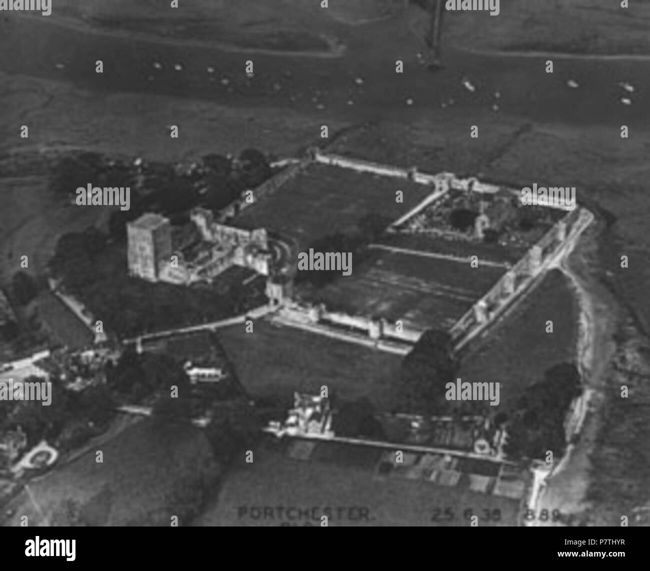An aerial view of Portchester Castle in Hampshire. The Ashmolean Museum's description is 'Porchester Castle taken 25 June 1938 (Album Ref 16, 10)'. 25 June 1938 14 Aerial photograph of Portchester Castle, 1938 Stock Photo