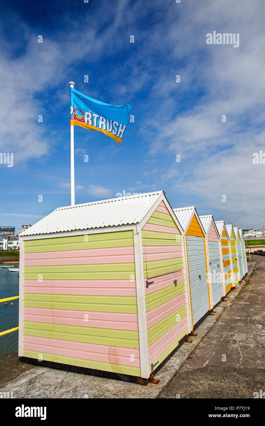 UK, Northern Ireland, Co Antrim, Portrush, beach huts on the harbour south pier Stock Photo