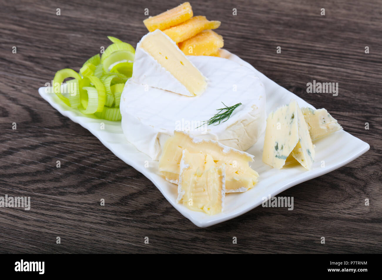 Cheese platter with brie, blue and parmesan Stock Photo Alamy