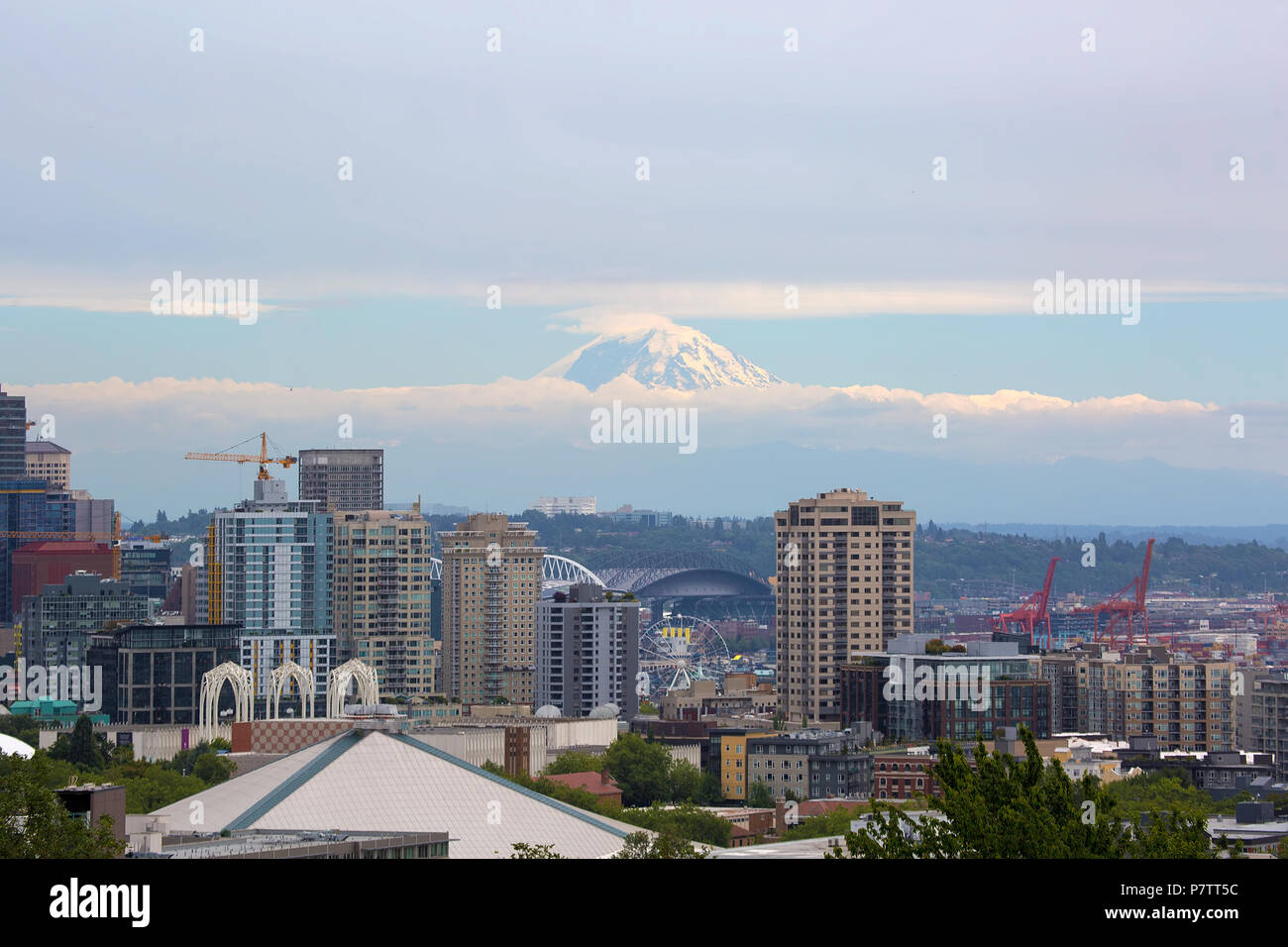 Seattle Washington downtown city skyline with Mount Rainier partially covered in clouds Stock Photo