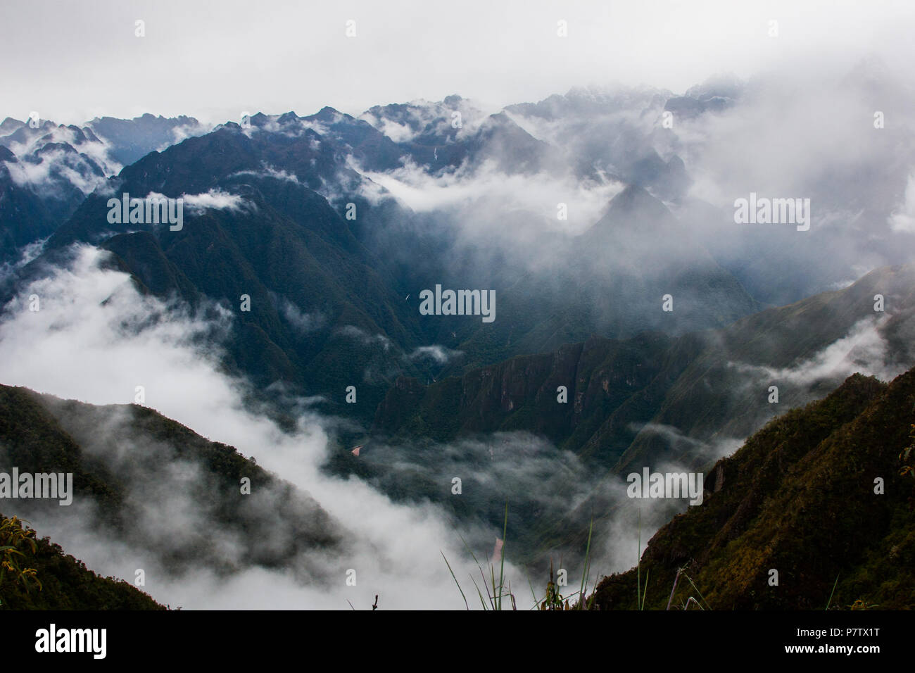 Panoramic Inca Train Panoramic inspirational view of the Andes mountains in mist on the Inca ...
