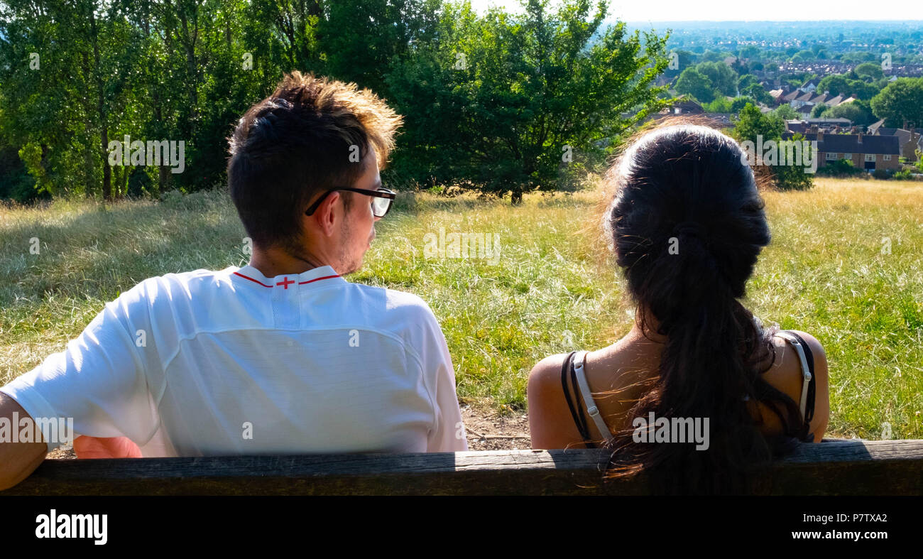 London, England. 7th July 2018. Ekta and Dan enjoying the view over Harrow in the sunshine. The present heatwave is set to continue. ©Tim Ring/Alamy Live News Stock Photo