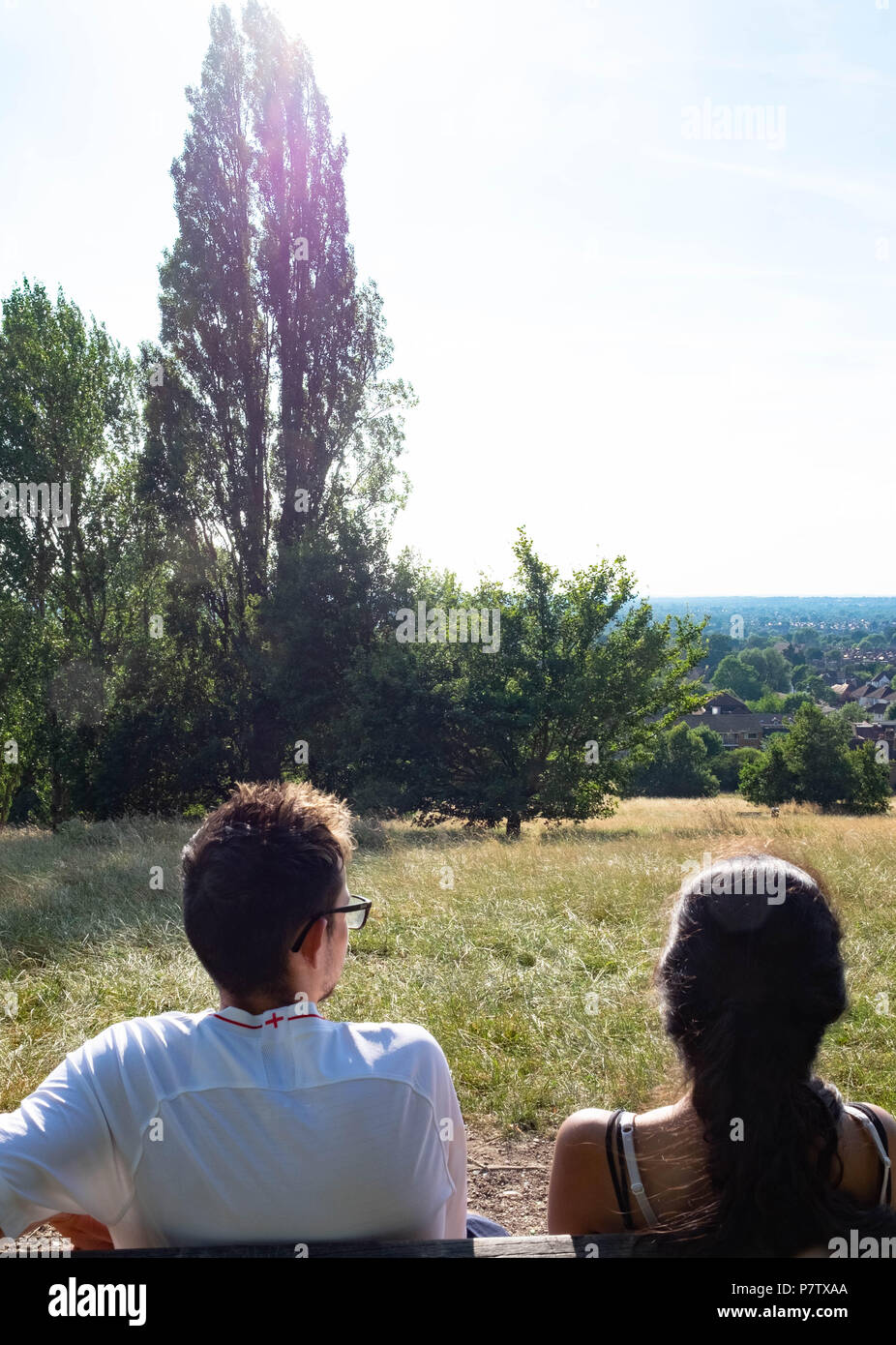 London, England. 7th July 2018. Ekta and Dan enjoying the view over Harrow in the sunshine. The present heatwave is set to continue. ©Tim Ring/Alamy Live News Stock Photo