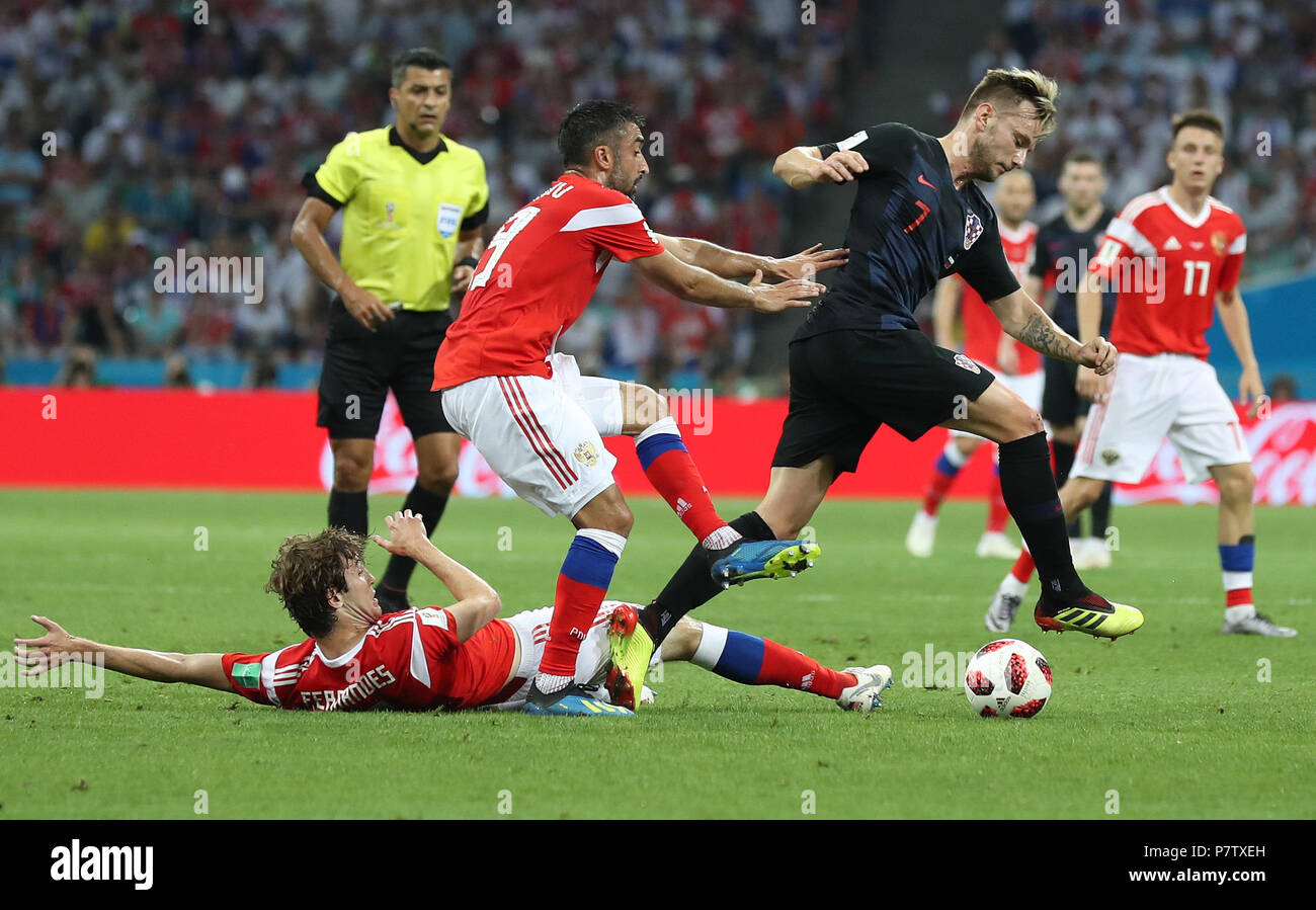 Sochi, Russia. 7th July, 2018. Ivan Rakitic (R front) of Croatia vies with Alexander Samedov (L front) and Mario Fernandes (bottom) of Russia during the 2018 FIFA World Cup quarter-final match between Russia and Croatia in Sochi, Russia, July 7, 2018. Credit: Xu Zijian/Xinhua/Alamy Live News Stock Photo