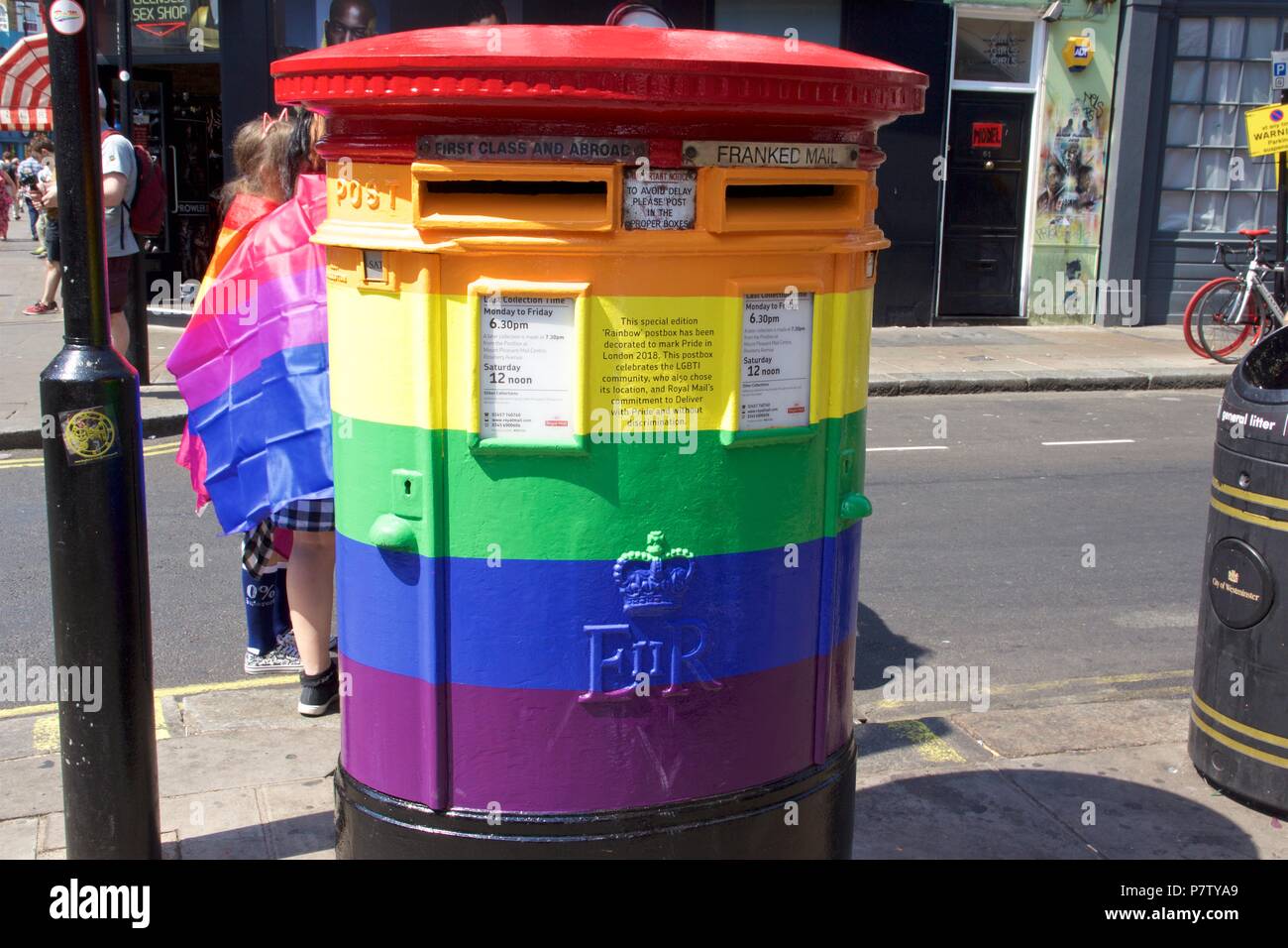 London, UK. 7th July 2018. Pride celebrations in London. A rainbow British postbox on Brewer street, Soho to celebrate Pride in London 2018. It says on it 'This postbox celebrates the LGBTI community, who also chose its location, and the Royal Mail's commitment to Deliver with pride and without discrimination'. Credit: Dimple Patel/Alamy Live News Stock Photo